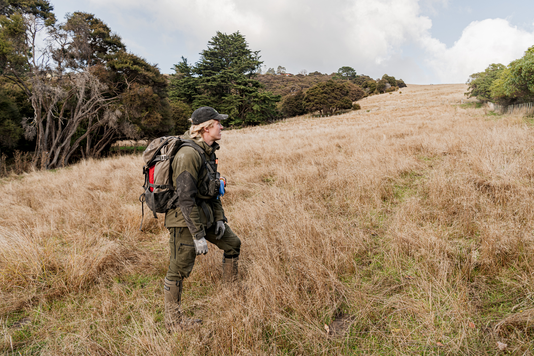 Pest Free Banks Peninsula team member Blake Thomson inspects possum toxin traps on private properties on Banks Peninsula, New Zealand, on May 9, 2024