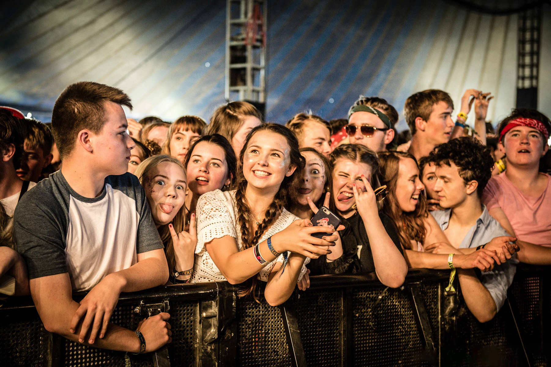 Front row at Leeds Festival ... music fans smile for camera photographed by Mark Wheelwright from Aire Street Studios Leeds