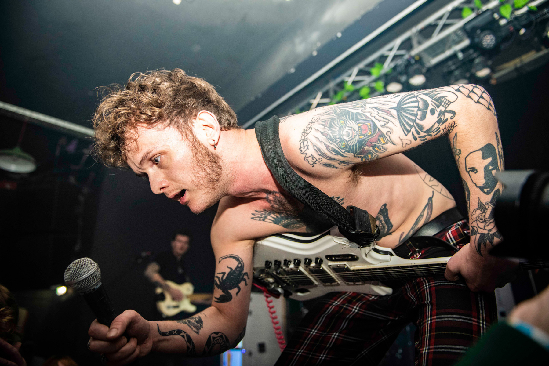 image of lead singer from strange bones performing bare chested on stage at rifest January 25th 2020 at LEEDS BELGRAVE music hall photograph by Mark Wheelwright Aire Street Studio Leeds