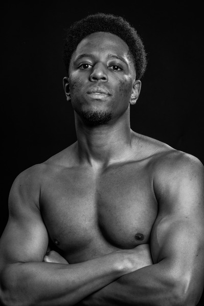 OG:Image Black model with no top muscles in black and white Photographed in Aire Street Studio by Mark Wheelwright