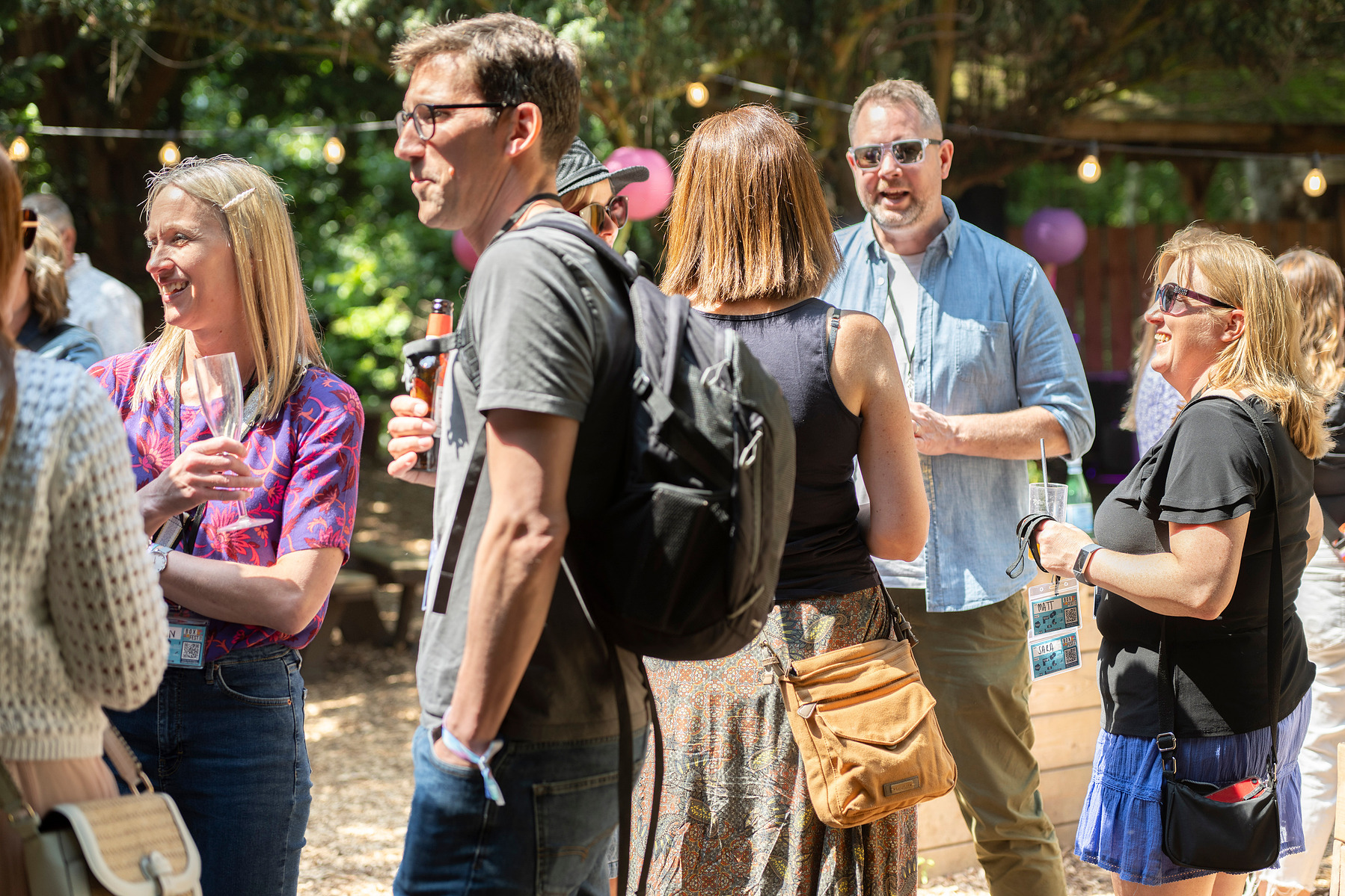 People socialising on summers day Woodland copse festival scene taken of Box Clever consulting at Hazlewood Castle photographed by Mark Wheelwright from Aire Street Studios Leeds