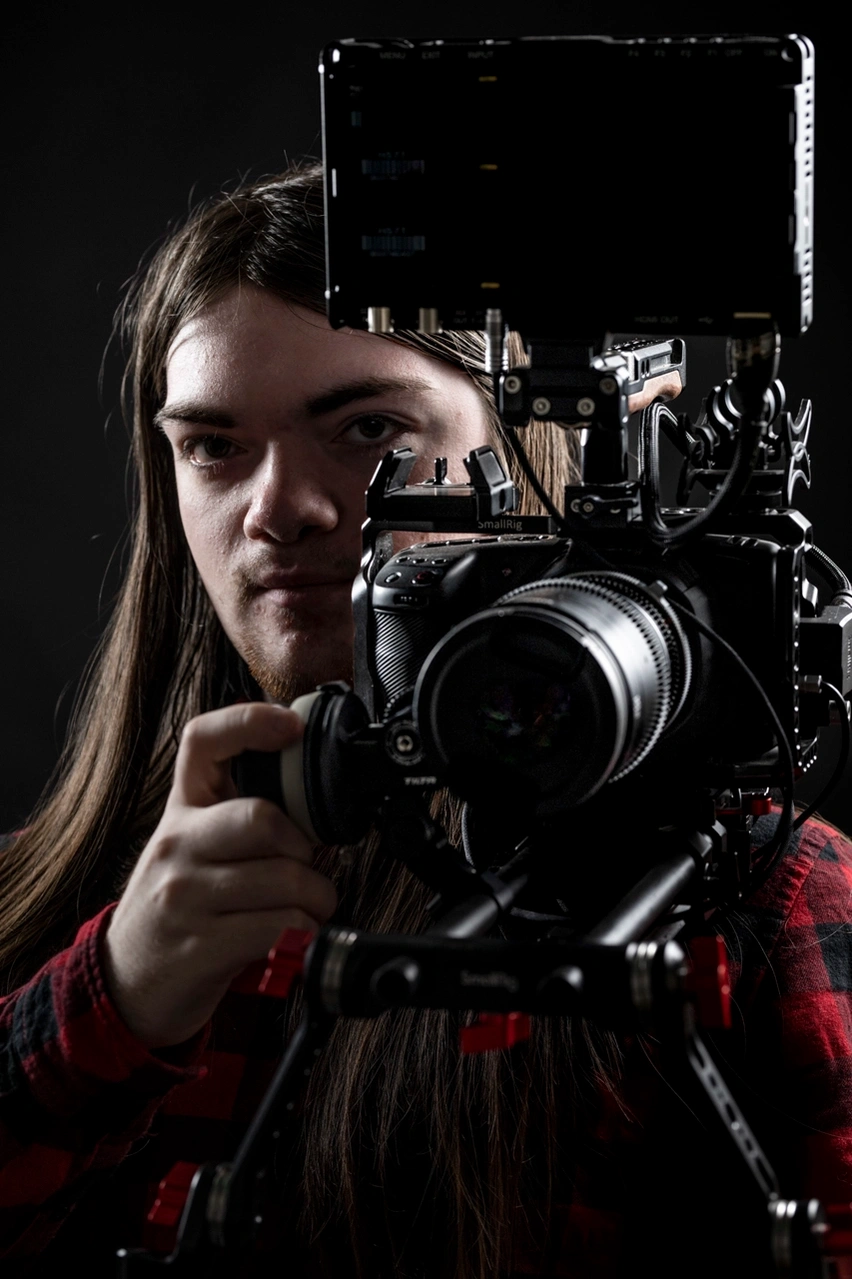 camera operator in moody lighting with camera rig at Aire Street Studio