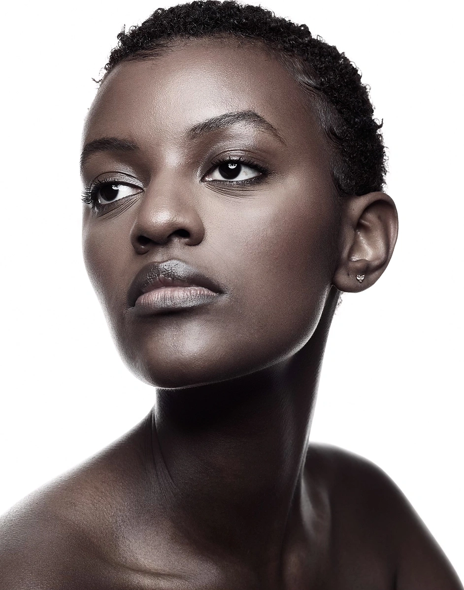 Monochrome image of black female model with flawless skin tone captured on a photo studio hire at Aire Street Studio Leeds