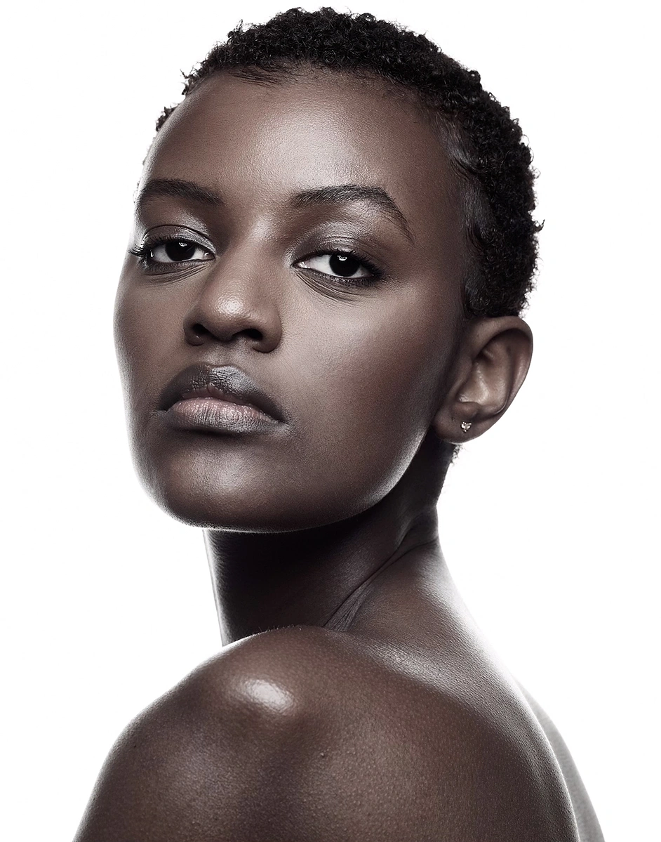 Monochrome image of black female model with flawless skin tone captured on a photo studio hire at Aire Street Studio Leeds