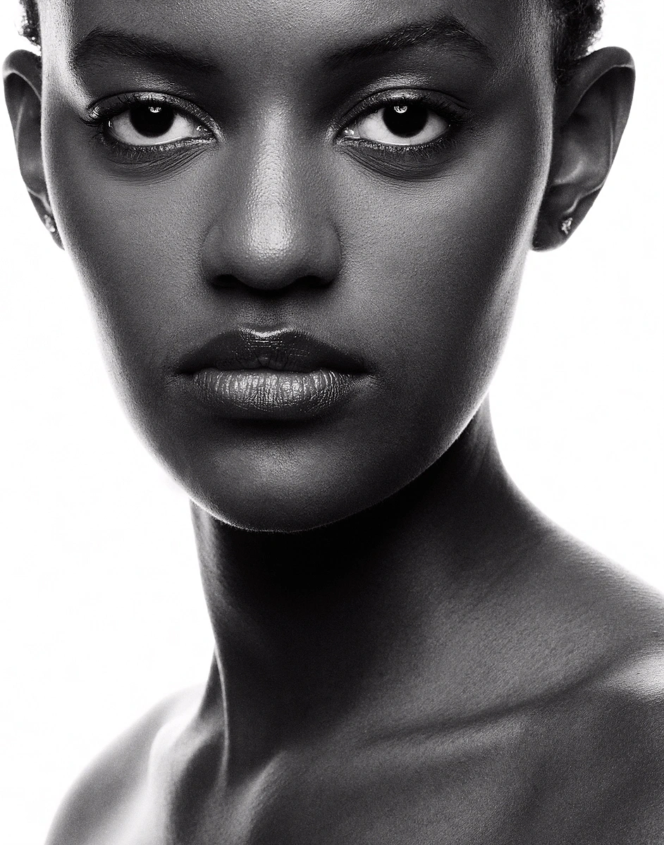 Monochrome image of black female model with flawless skin tone captured on a photo studio hire at Aire Street Studio Leeds