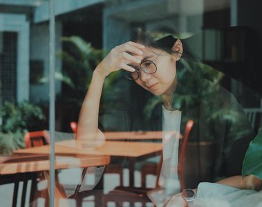 Sad woman at restaurant