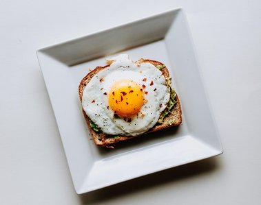 Egg served with toast on a plate