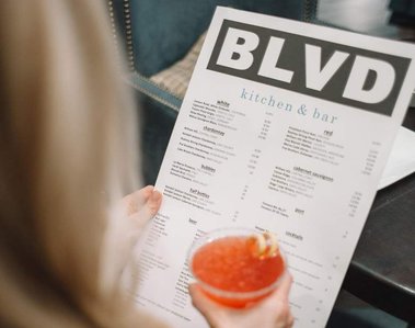 Woman looking at overwhelming menu