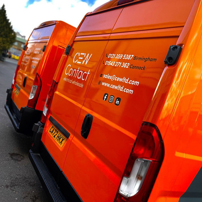 CEW logo and branding on van rear panels. Core orange background with white logo and white and dark grey copy and social icons