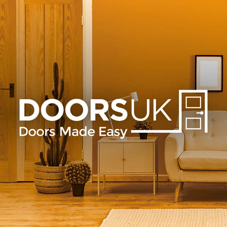 Doors Uk logo overlaid living space photo with sofa, side table, plants and oak door