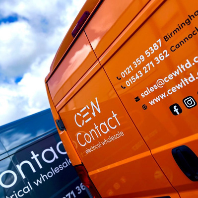 CEW logo and branding on van rear panel. Cropped view of van side logo