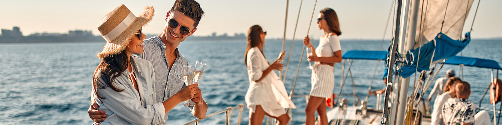 Young affluent people having fun on yacht in the sun