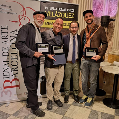 Puerto Rican artists receiving an award in Barcelona.