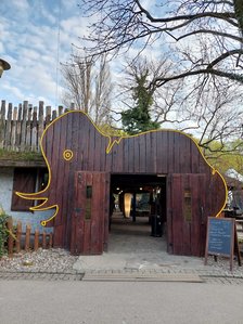 Pub Lolek (Pole Mokotowskie, Warsaw, Poland) new entrance with swinging doors in a shape of pub's logo - mammoth.