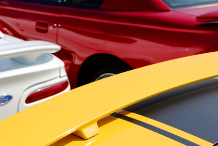 Mustang car show. Colors of hoods. Yellow Mustang.