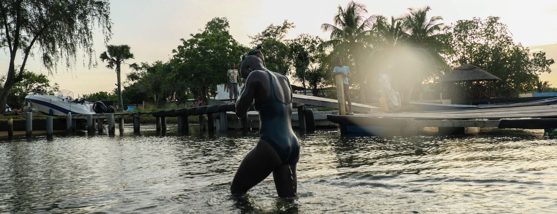 Yvette emerges from the water at the end of her swim. 