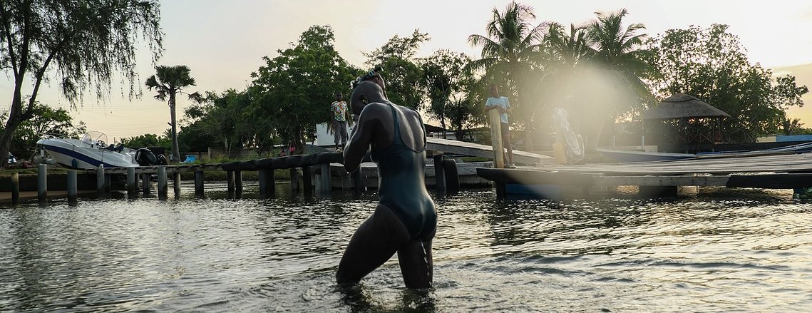 Yvette emerges from the water at the end of her swim. 