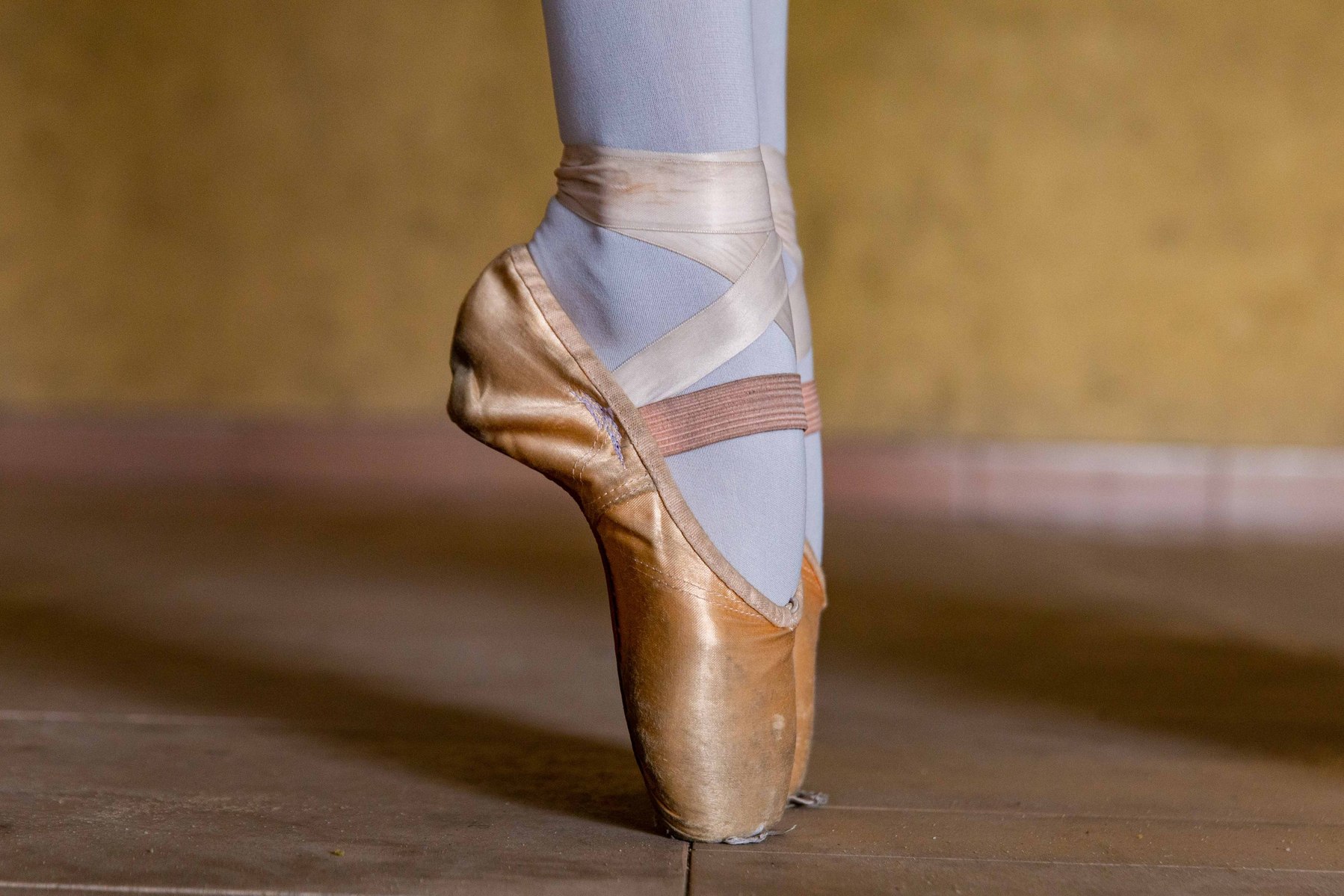 A students stands en pointe in a pointe shoe during rehearsals at Leap of Dance Academy, Ajangbadi in Lagos on July 3, 2020. Leap of Dance Academy is a ballet dance academy focused on empowering young talents who are willing to learn ballet dancing but c