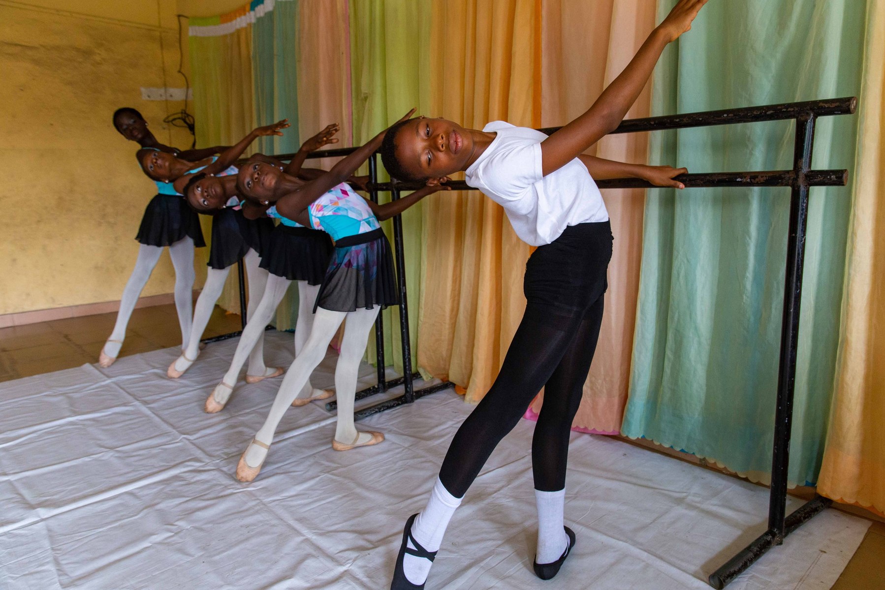 Students stretching during rehearsals at the Leap of Dance Academy in Lagos on July 3, 2020. Leap of Dance Academy is a ballet dance academy focused on empowering young talents who are willing to learn ballet dancing but cannot afford the luxury of dance