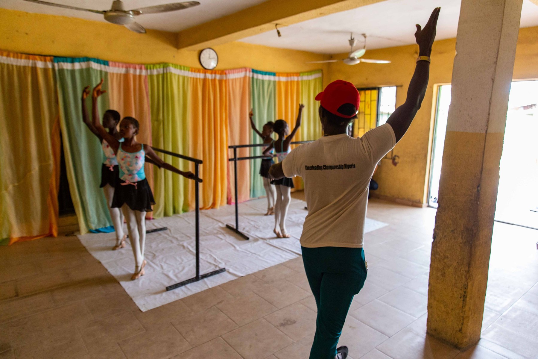 Dance tutor Daniel Owoseni Ajala showing the students ballet stretch routines during rehearsals at Leap of Dance Academy in Ajangbadi, Lagos on July 3, 2020. Leap of Dance Academy is a ballet dance academy focused on empowering young talents who are will