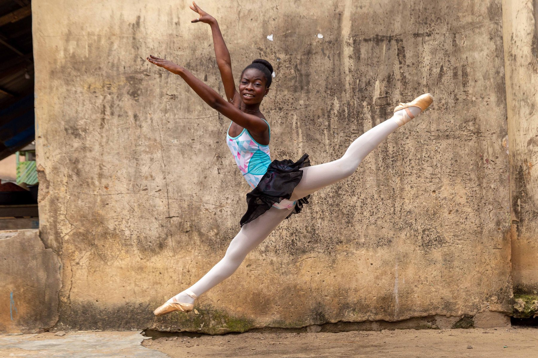A student of the Leap of Dance Academy, Olamide Olawale performing a dance routine at Okelola street Ajangbadi, in Lagos on July 3, 2020. Leap of Dance Academy is a ballet dance academy focused on empowering young talents who are willing to learn balle