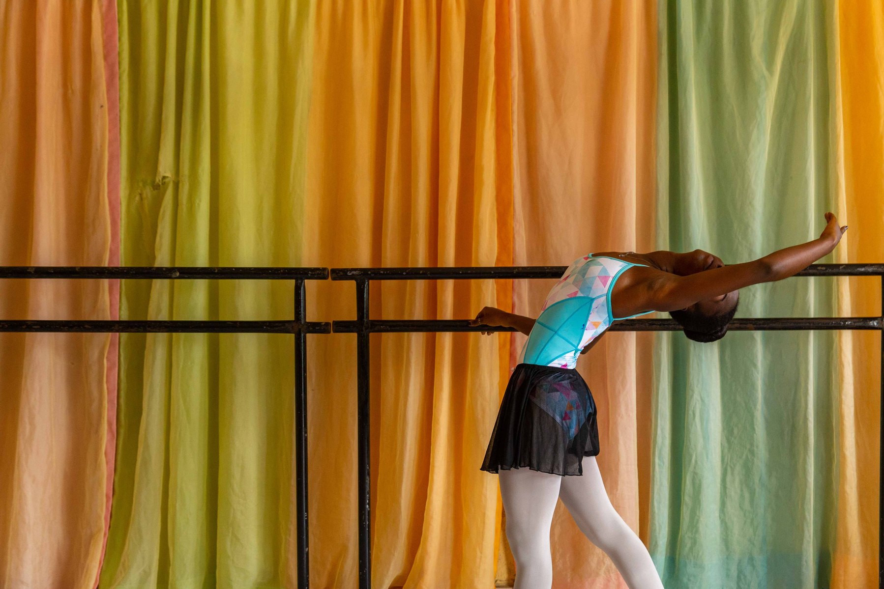 Olamide Olawale stretches during rehearsals at the Leap of Dance Academy in Lagos on July 3, 2020. Leap of Dance Academy is a ballet dance academy focused on empowering young talents who are willing to learn ballet dancing but cannot afford the luxury of