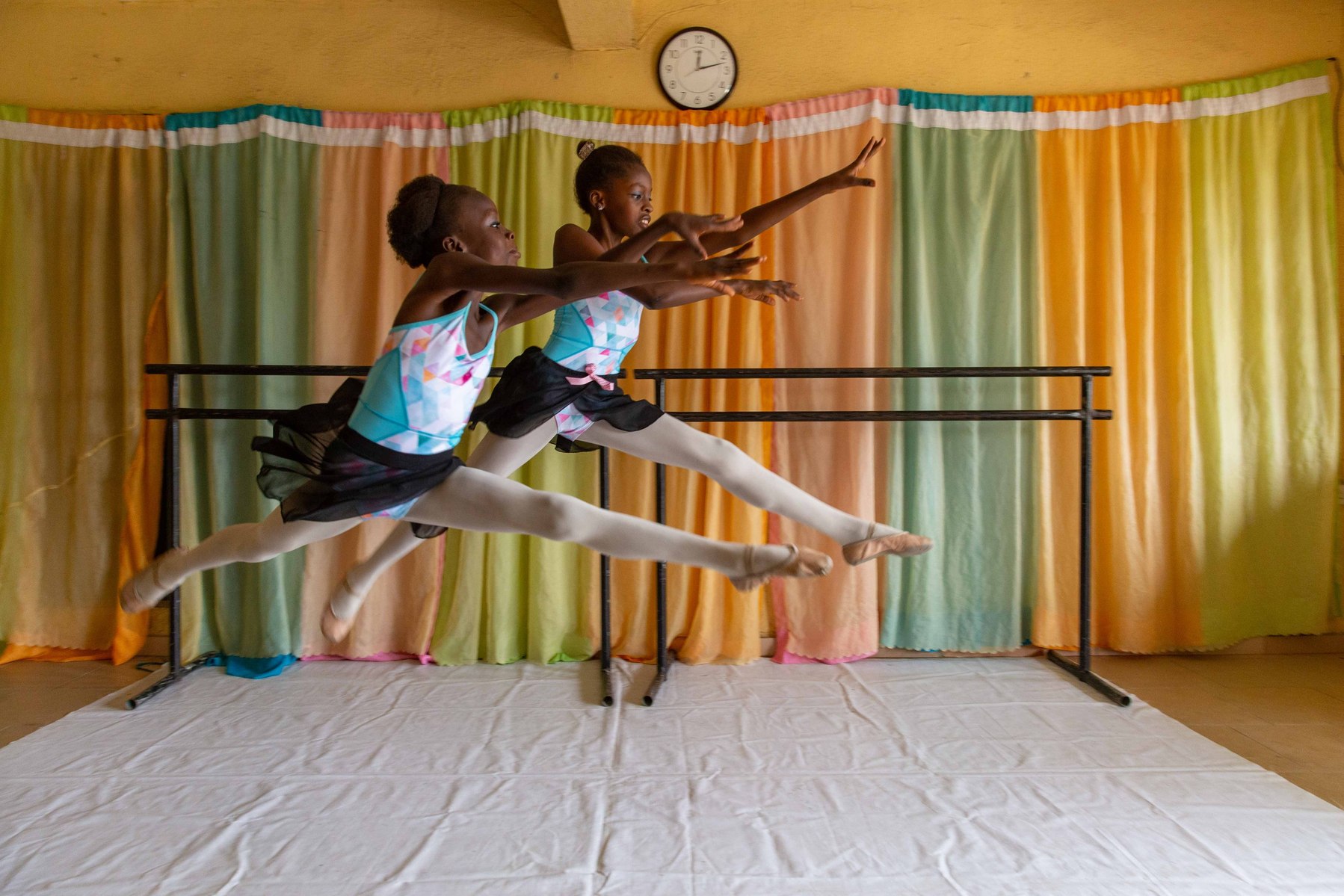Two students practicing a dance routine during rehearsals at the Leap of Dance Academy in Lagos on July 3, 2020. Leap of Dance Academy is a ballet dance academy focused on empowering young talents who are willing to learn ballet dancing but cannot afford