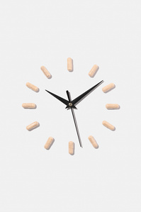 Nootrishop X Scott Uzoho -- product still-life photography of supplements in a clock like formation with clock arms facing ten past ten  