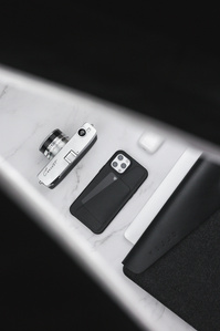 Mujjo X Scott Uzoho -- product still-life photography of iPhone case with MacBook Pouch AirPods and Canon Cannot Camera vintage 1960