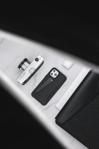 Mujjo X Scott Uzoho -- product still-life photography of iPhone case with MacBook Pouch AirPods and Canon Cannot Camera vintage 1960