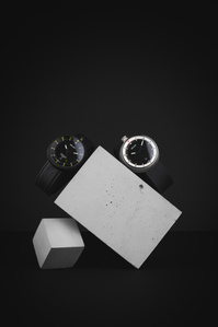 Bolido Rocks X Scott Uzoho -- product still-life photography of swiss watches balancing on concrete blocks 