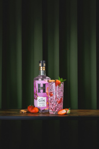 Hardakers  X Scott Uzoho -- product still-life photography of berry flavoured gin and cocktail infront of draped emerald green curtain 