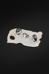Contrast Jewellery X Scott Uzoho -- product still-life photography of 3 stainless signet rings on burnt pirate like paper 