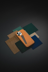 Mujjo X Scott Uzoho -- product still-life photography of iPhone case with MacBook Pouch AirPods and Canon Cannot Camera vintage 1960