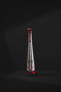 Moda X Scott Uzoho -- product still-life photography of watermelon tequila 100% agave on a black background and stark shadow 