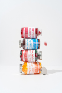 Nootrishop X Scott Uzoho -- product still-life photography of supplements bottle balancing in a stacked formation 