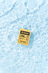 Lexar X Scott Uzoho -- product still-life photography of camera SD card floating over rippling water