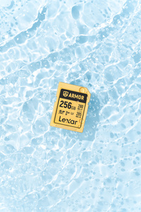 Lexar X Scott Uzoho -- product still-life photography of camera SD card floating over rippling water