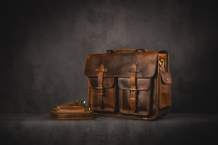 Kalting Bags X Scott Uzoho -- product still-life photography of leather bag with strap on concrete background shelf 
