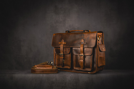 Kalting Bags X Scott Uzoho -- product still-life photography of leather bag with strap on concrete background shelf 