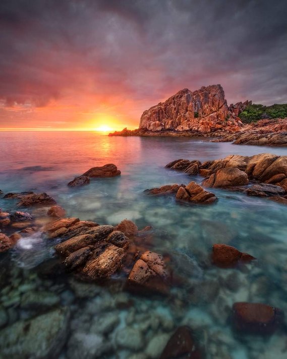 A colourful sunrise behind the rugged rock formations in Western Australia.