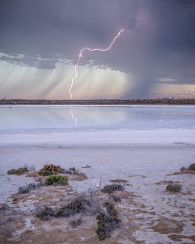 Lightning reflects on a salt lake in outback Australia.