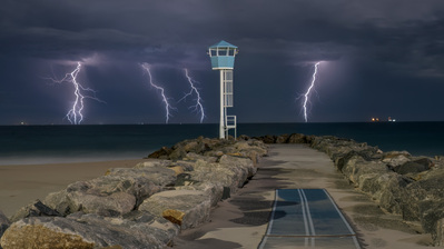 Multiple lightning strikes at a suburban beach in Perth.