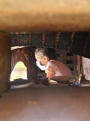 Loading the wood kiln. Photo by Nancy Caras.