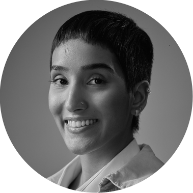 A black and white photo of Shivani smiling