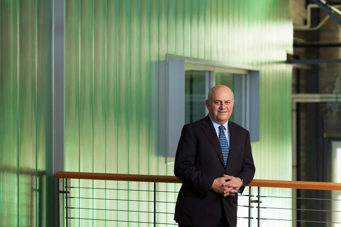 CEO portrait 1, standing in a warehouse environment.