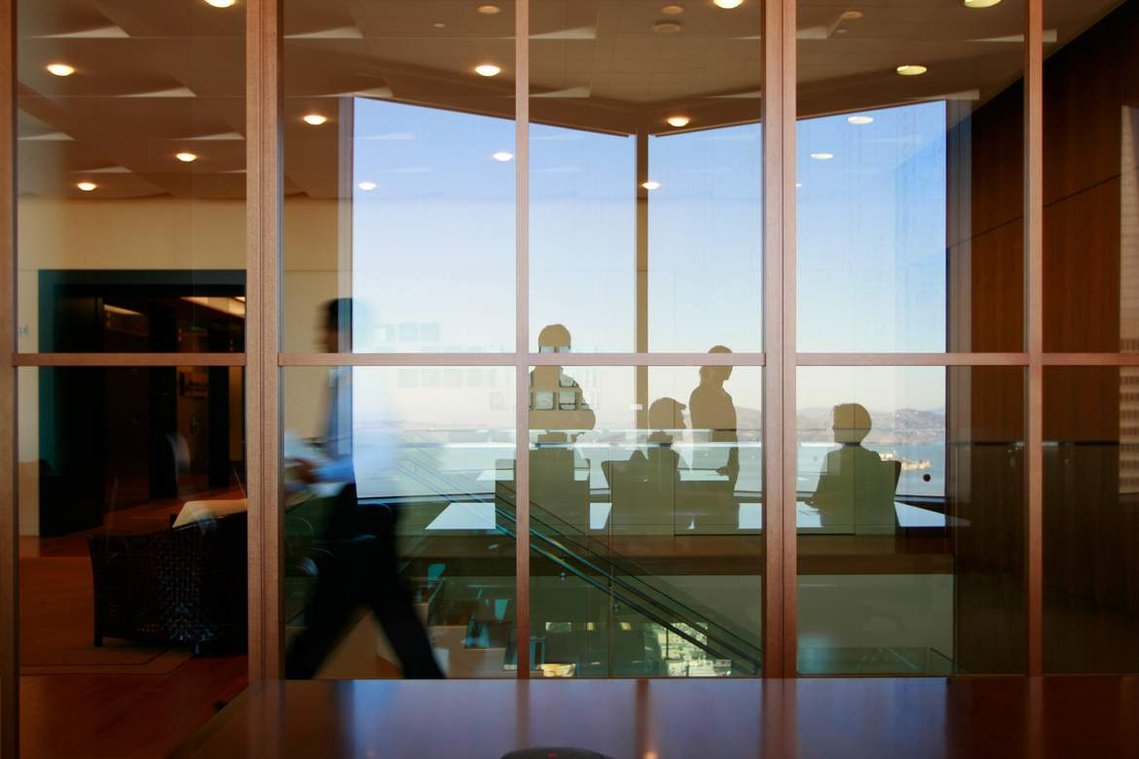 Photo of an abstract image of an office interior making use of window reflections