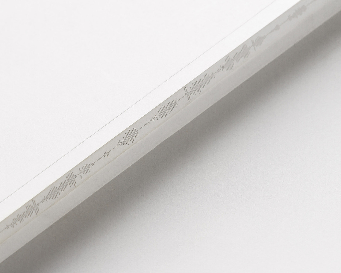 Zoomed in detail of the AIGA SF 25th Anniversary book spine, showing that the graphic of the stylized seismograph lines was carried to the outside of the book spine