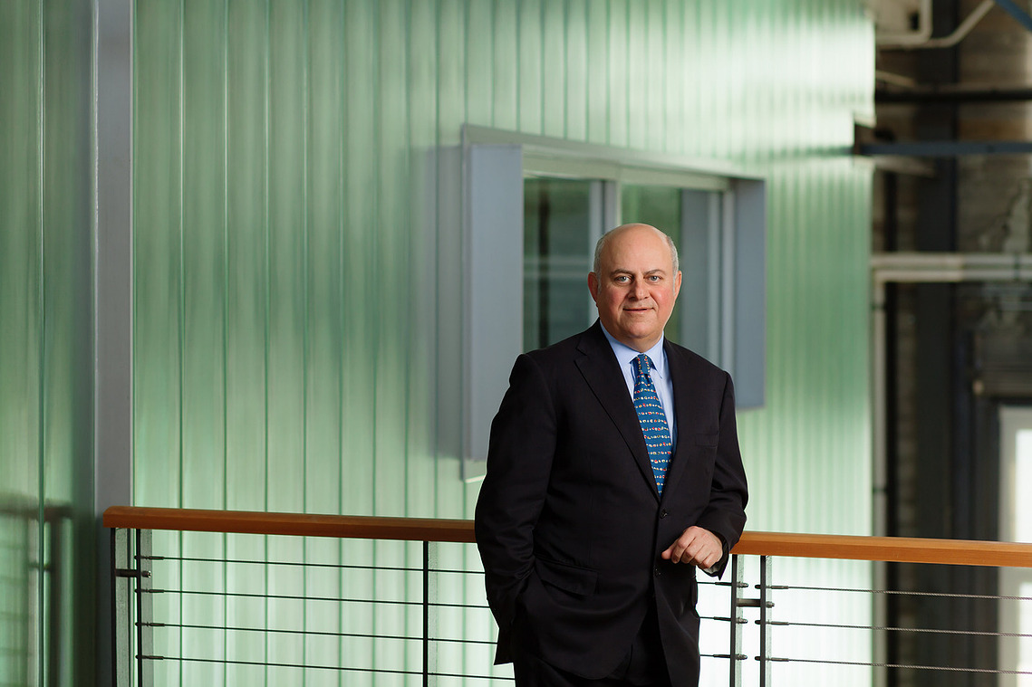 Portrait of the CEO of a major shipping company in the lobby of his office space.