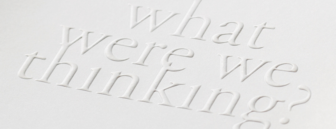 Detail photo of the AIGA SF 25th Year Anniversary book cover, zoomed in to show the detail of the embossed text stating 